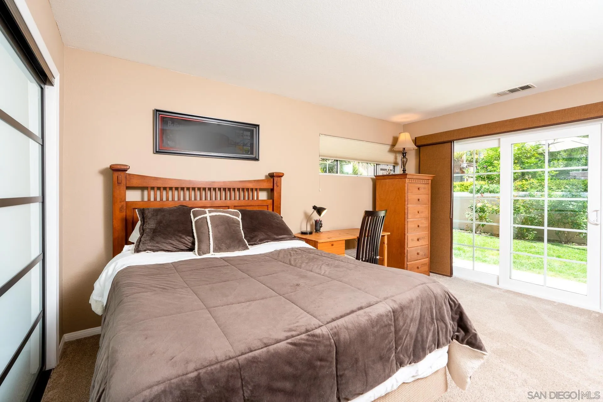 1269 Rainbow Ridge Lane Encinitas, CA 92024 - Photo 14 of 27 a bed sitting in a bedroom next to a window