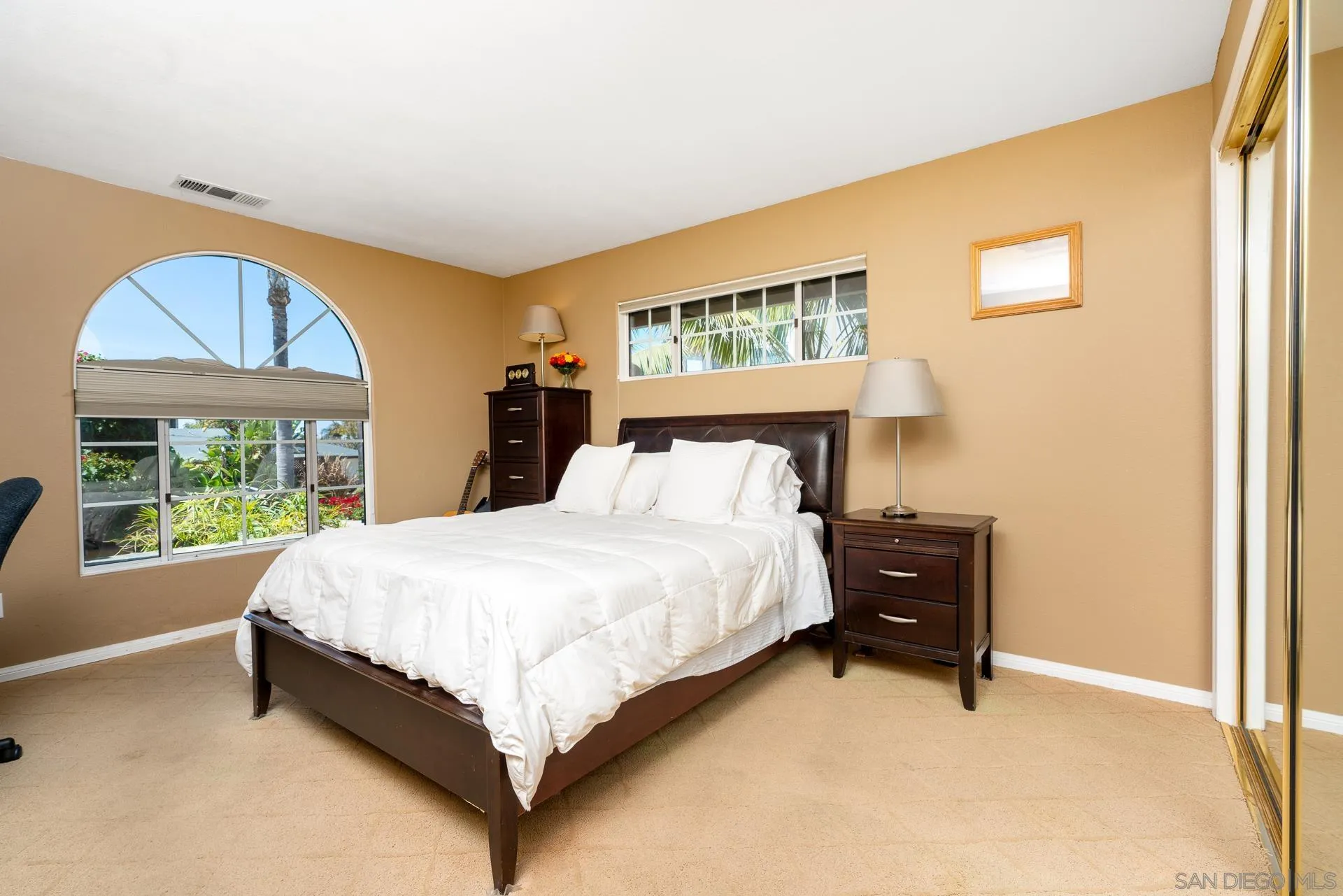 1269 Rainbow Ridge Lane Encinitas, CA 92024 - Photo 16 of 27 a bed sitting in a bedroom next to a window