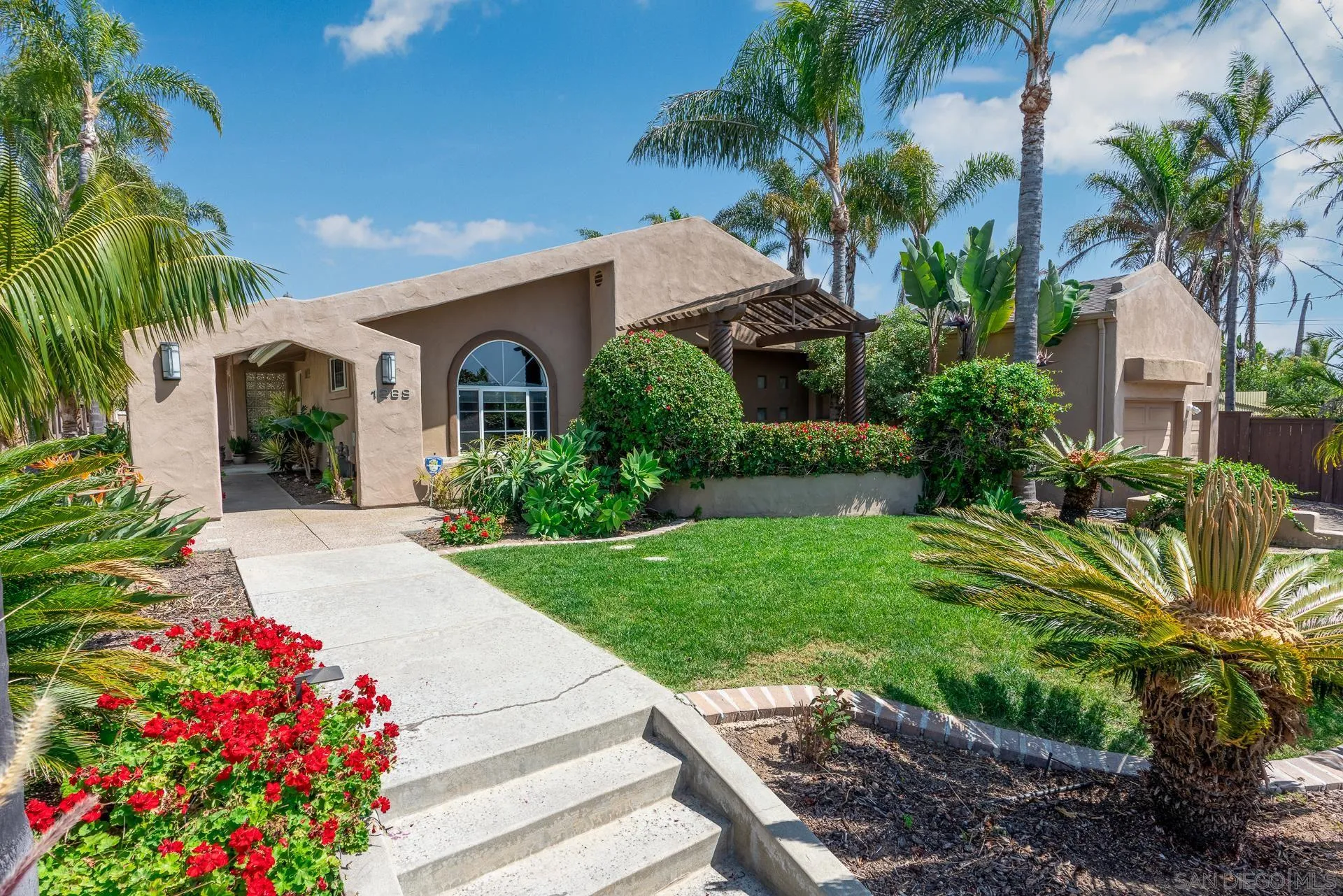 1269 Rainbow Ridge Lane Encinitas, CA 92024 - Photo 2 of 27 a front view of house with yard and green space