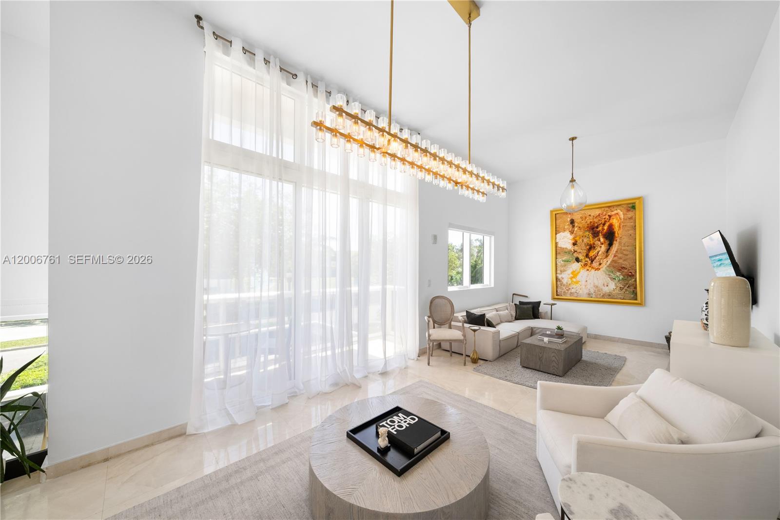 400 Alton Road, Unit TH1A Miami Beach, FL 33139 - Photo 11 of 32 a living room with furniture and a floor to ceiling window