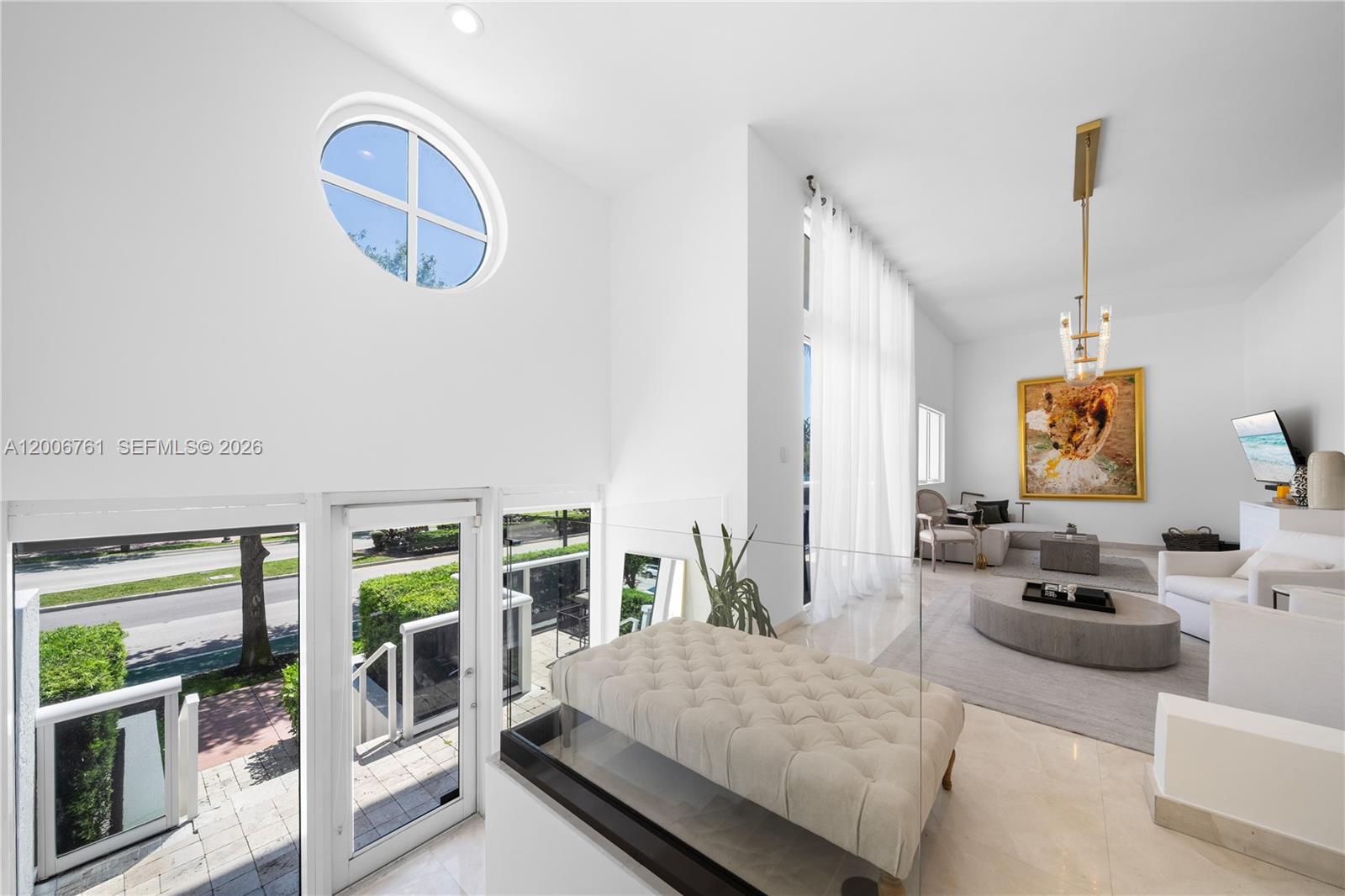 400 Alton Road, Unit TH1A Miami Beach, FL 33139 - Photo 15 of 32 a living room with furniture and a wooden floor