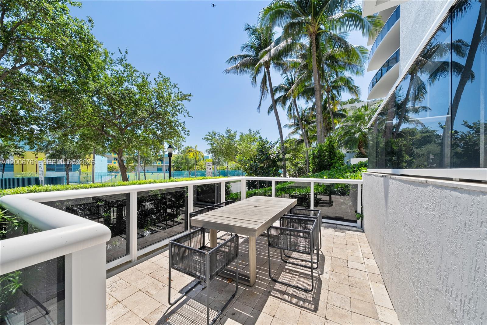 400 Alton Road, Unit TH1A Miami Beach, FL 33139 - Photo 16 of 32 a view of a patio with iron fence