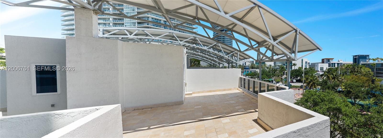 400 Alton Road, Unit TH1A Miami Beach, FL 33139 - Photo 26 of 32 a view of an outdoor kitchen