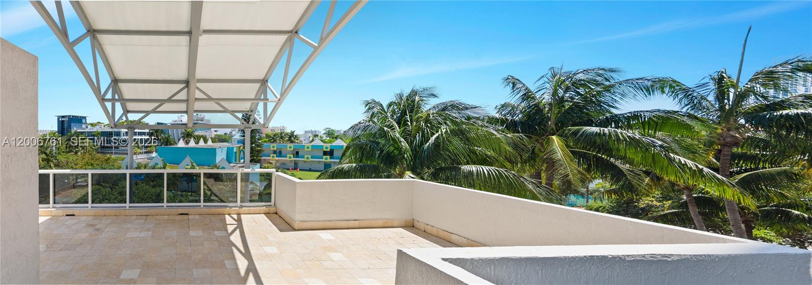 400 Alton Road, Unit TH1A Miami Beach, FL 33139 - Photo 27 of 32 a view of a swimming pool with a balcony