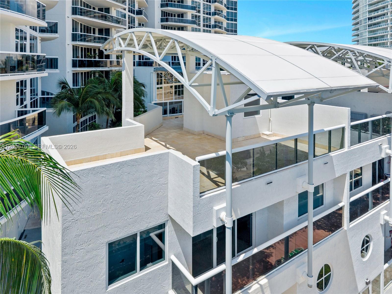 400 Alton Road, Unit TH1A Miami Beach, FL 33139 - Photo 28 of 32 a view of a building with many windows