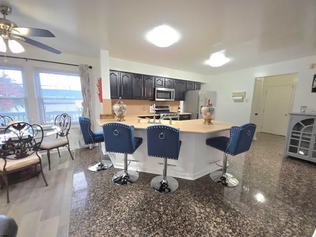 a kitchen with a sink cabinets and stainless steel appliances
