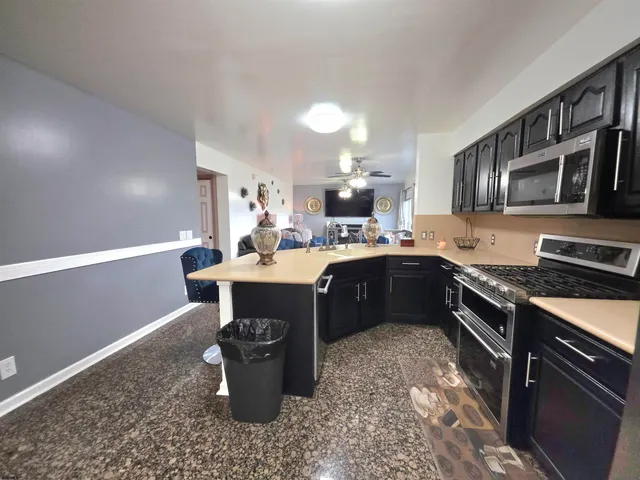 a kitchen with a stove and a sink