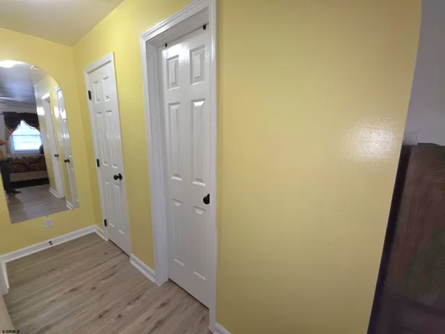 a bed room with a bed and a chandelier