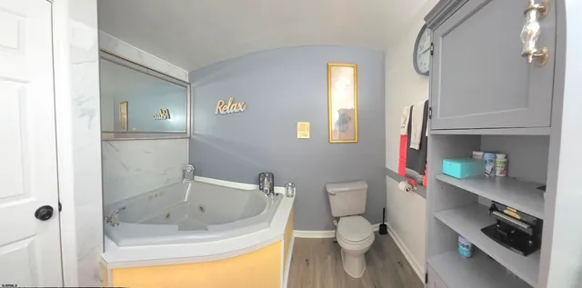 a backyard of a house with lots of green space and plants