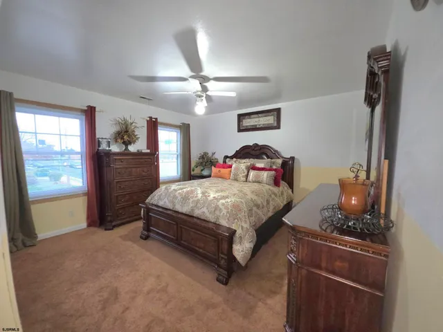 a view of a backyard with furniture and a fire pit
