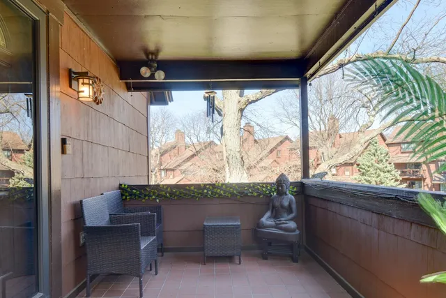 a view of a chair and table in the balcony