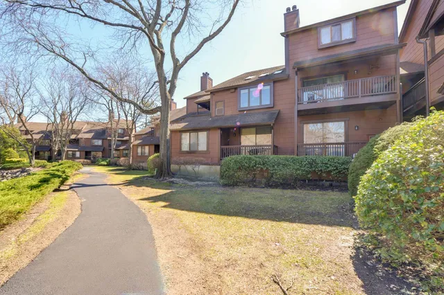 a view of swimming pool and green space
