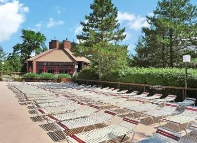 a view of a swimming pool with an outdoor space and seating area
