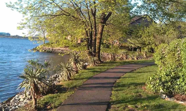 a view of swimming pool with outdoor seating and lake view