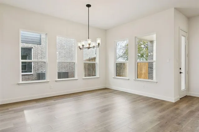 a kitchen with stainless steel appliances a stove a refrigerator a oven a sink with oven and refrigerator