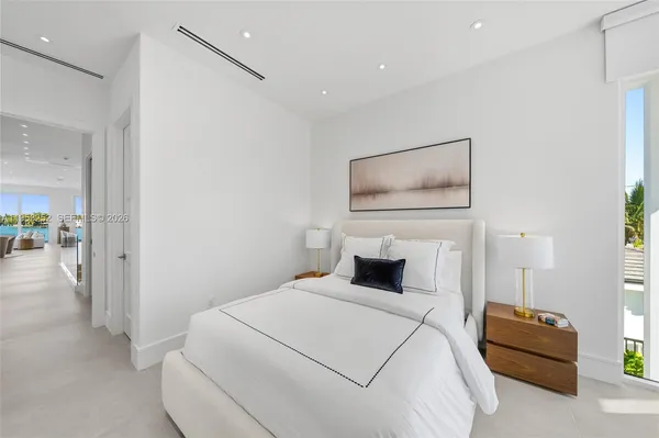 a bedroom with a bed and a couch
