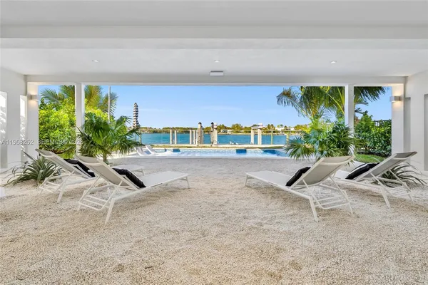 a view of a chairs and table in patio