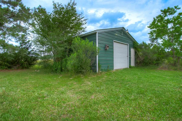 a view of a garage with a table and a chair