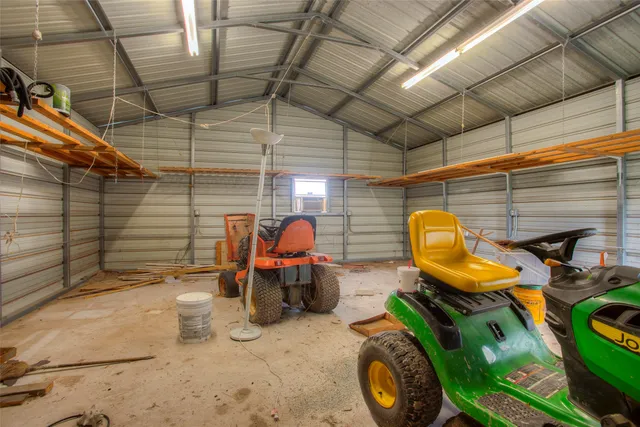 a view of a garage with a table and a chair
