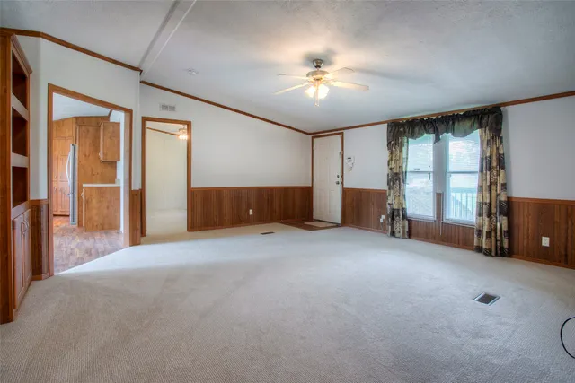 a view of an empty room with a window
