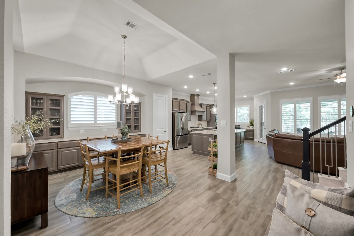 334 Torrey Bloom Loop Conroe, TX 77304 - Photo 11 of 46 Custom interior painting, Custom crown molding installed throughout and Plantation shutters throughout the home.