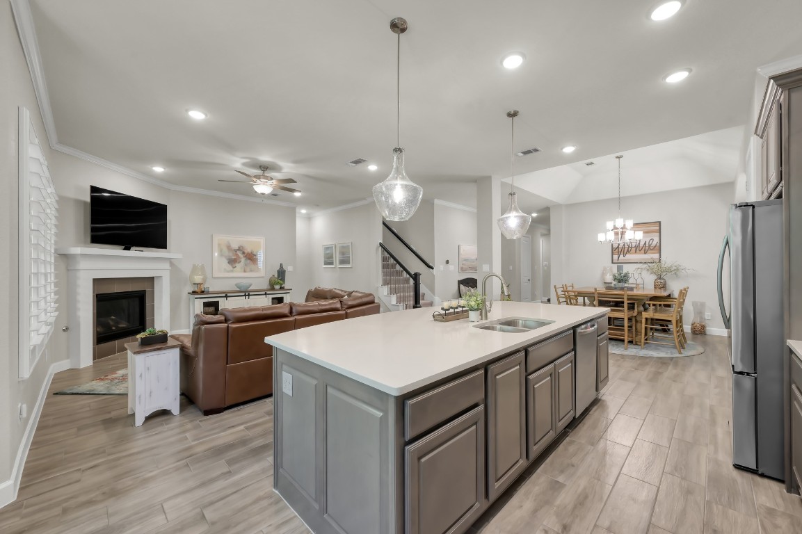 334 Torrey Bloom Loop Conroe, TX 77304 - Photo 17 of 46 Open-concept living with seamless flow from kitchen to family room.