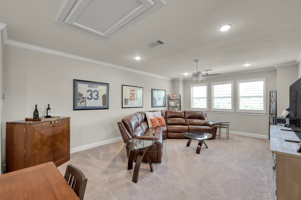 334 Torrey Bloom Loop Conroe, TX 77304 - Photo 31 of 46 Spacious upstairs game room with abundant natural light and versatile layout—perfect for entertaining, media, or play space.