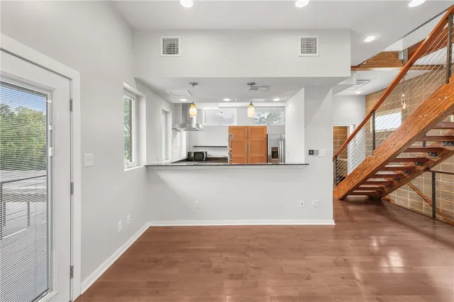 a view of a hallway with stairs