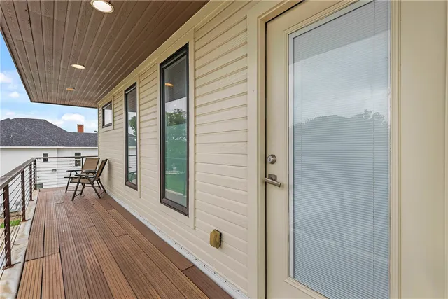a view of a balcony with chairs