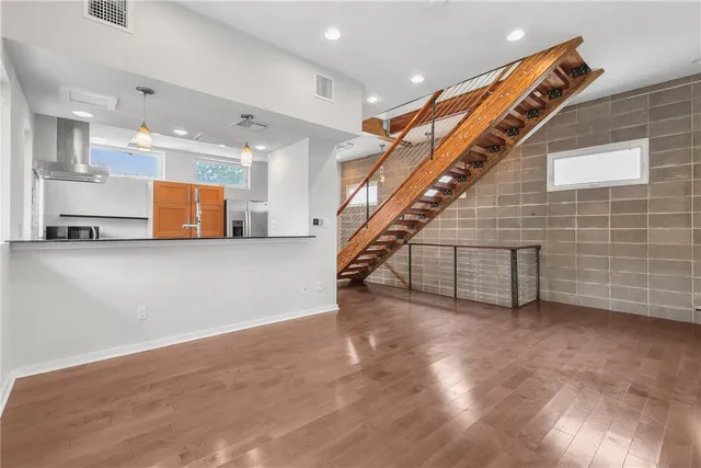 a view of an empty room with stairs