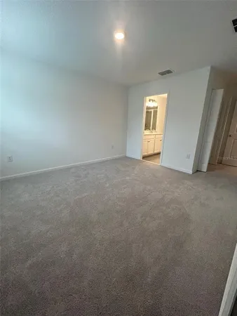 an empty room with closet area