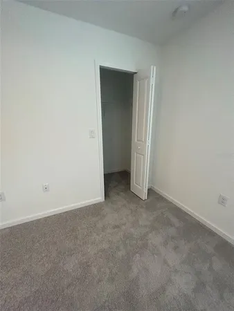 a bathroom with a double vanity sink mirror and toilet