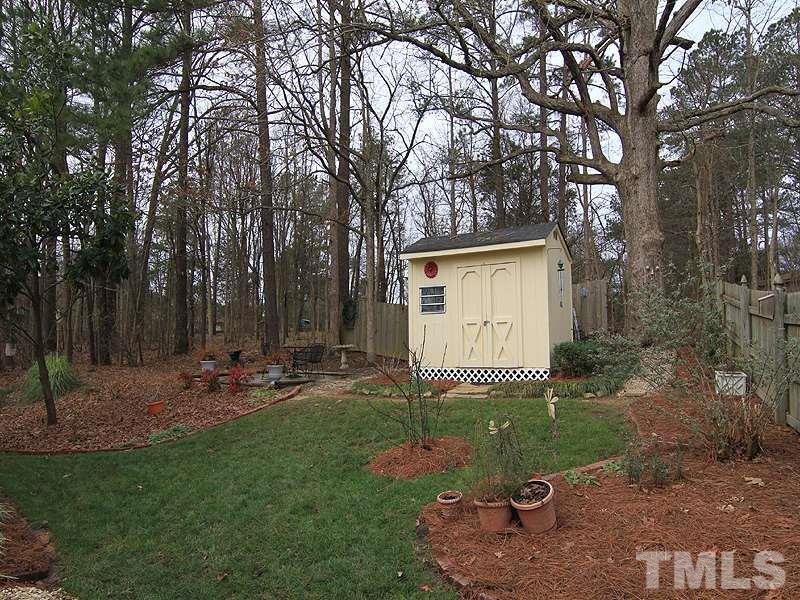 5121 Silverdene Street Raleigh, NC 27616 - Photo 12 of 12 a backyard of a house with table and chairs