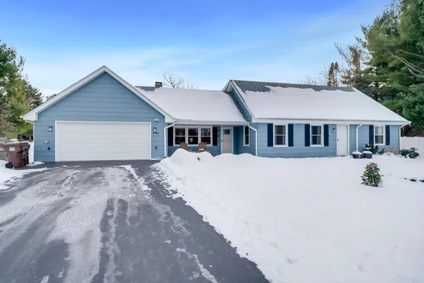 a house with trees in the background