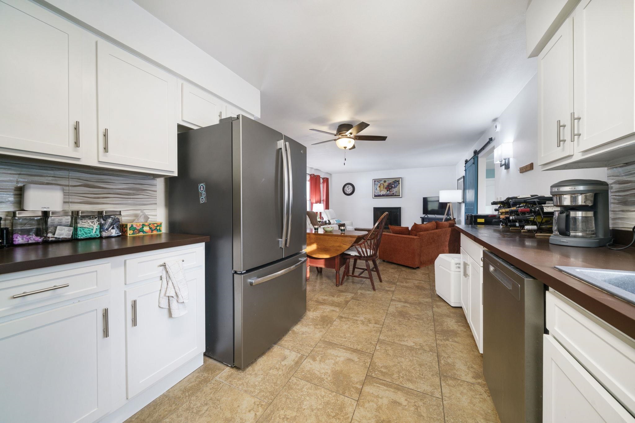 5393 Lakecrest Road Caledonia, IL 61011 - Photo 13 of 40 a kitchen with stainless steel appliances granite countertop a refrigerator sink and cabinets