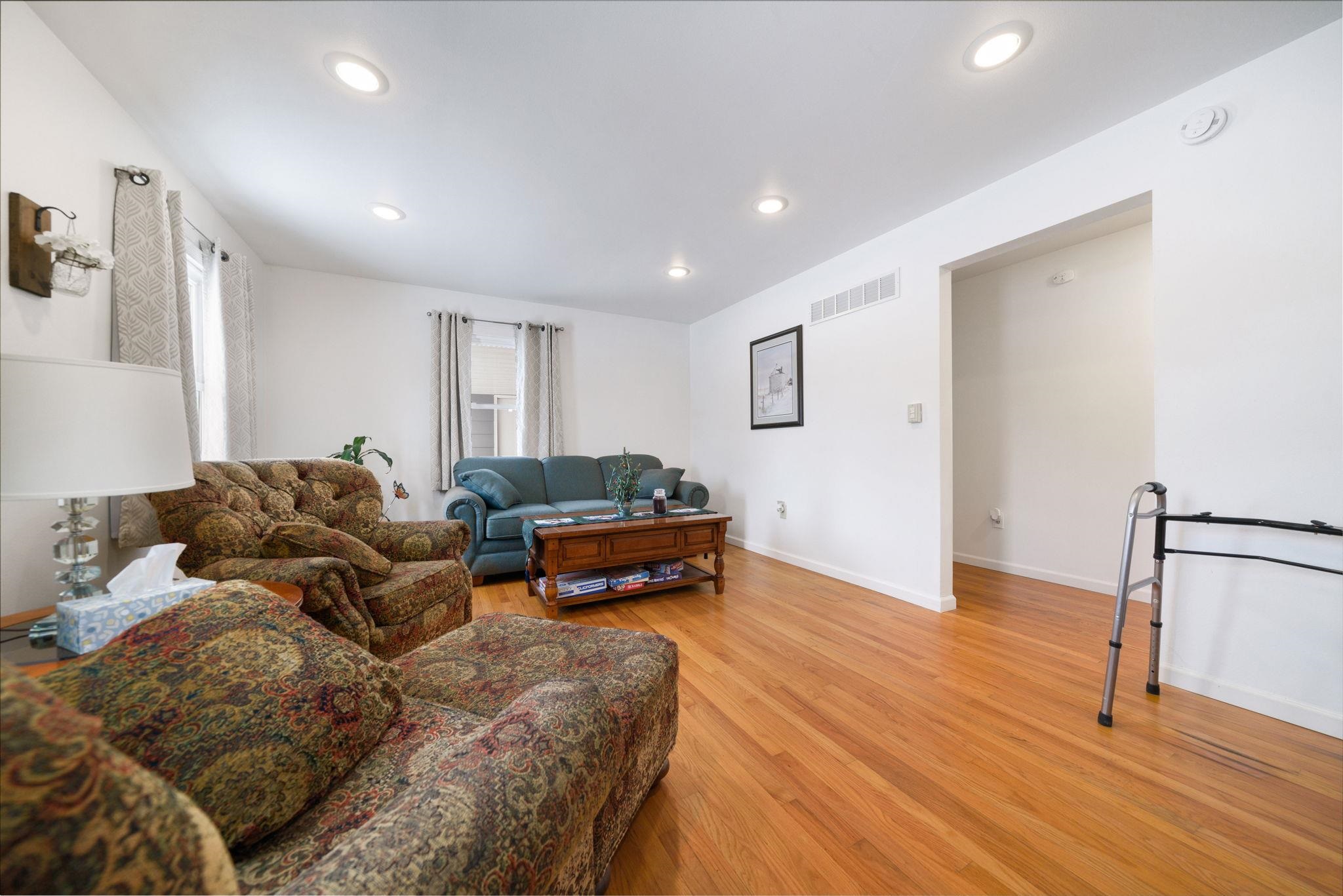 5393 Lakecrest Road Caledonia, IL 61011 - Photo 17 of 40 a living room with furniture and a wooden floor