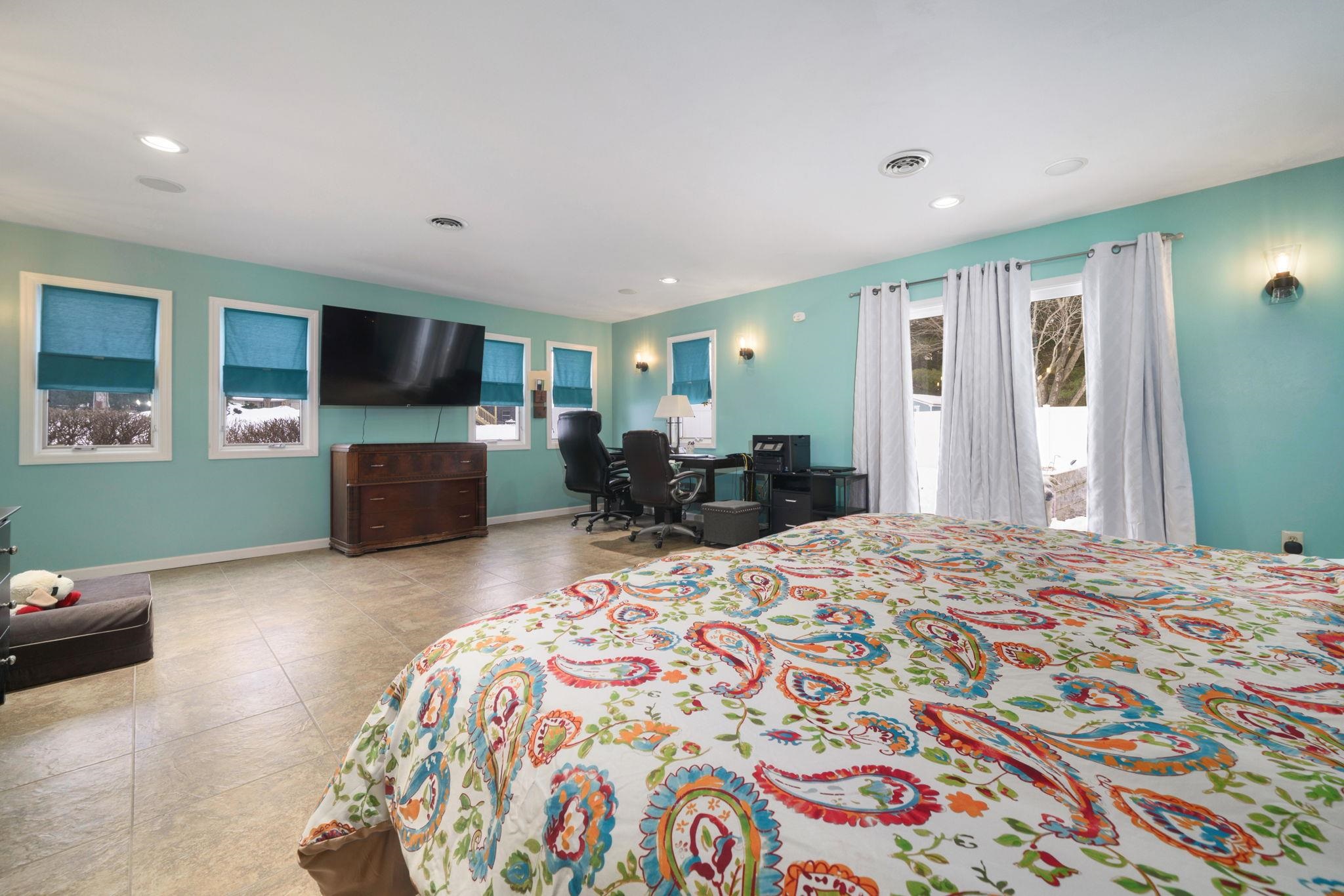 5393 Lakecrest Road Caledonia, IL 61011 - Photo 18 of 40 a bedroom with a bed and a flat screen tv