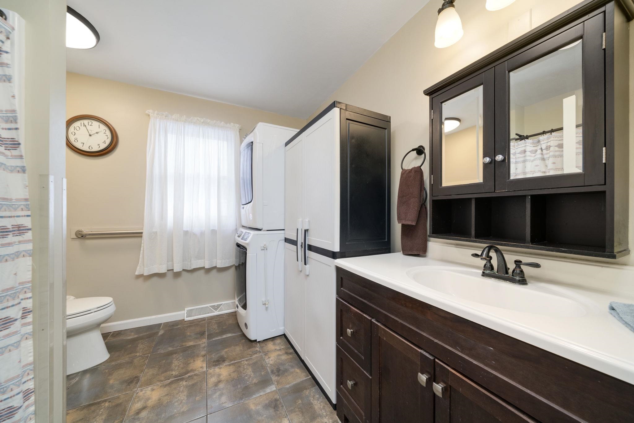 5393 Lakecrest Road Caledonia, IL 61011 - Photo 21 of 40 a bathroom with a sink a toilet and a mirror