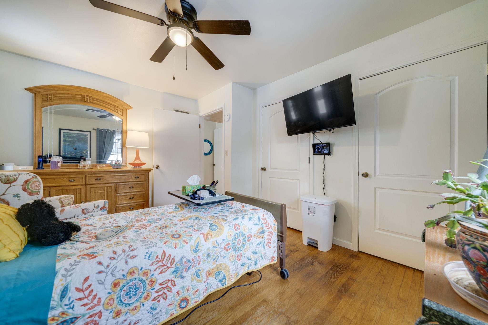 5393 Lakecrest Road Caledonia, IL 61011 - Photo 25 of 40 a bedroom with a bed and flat screen tv