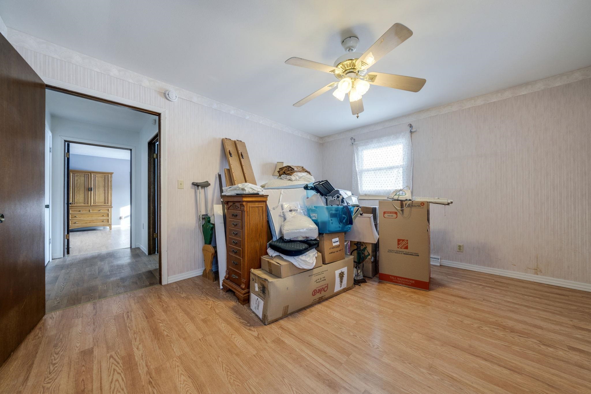 5393 Lakecrest Road Caledonia, IL 61011 - Photo 28 of 40 a living room with furniture and a chandelier
