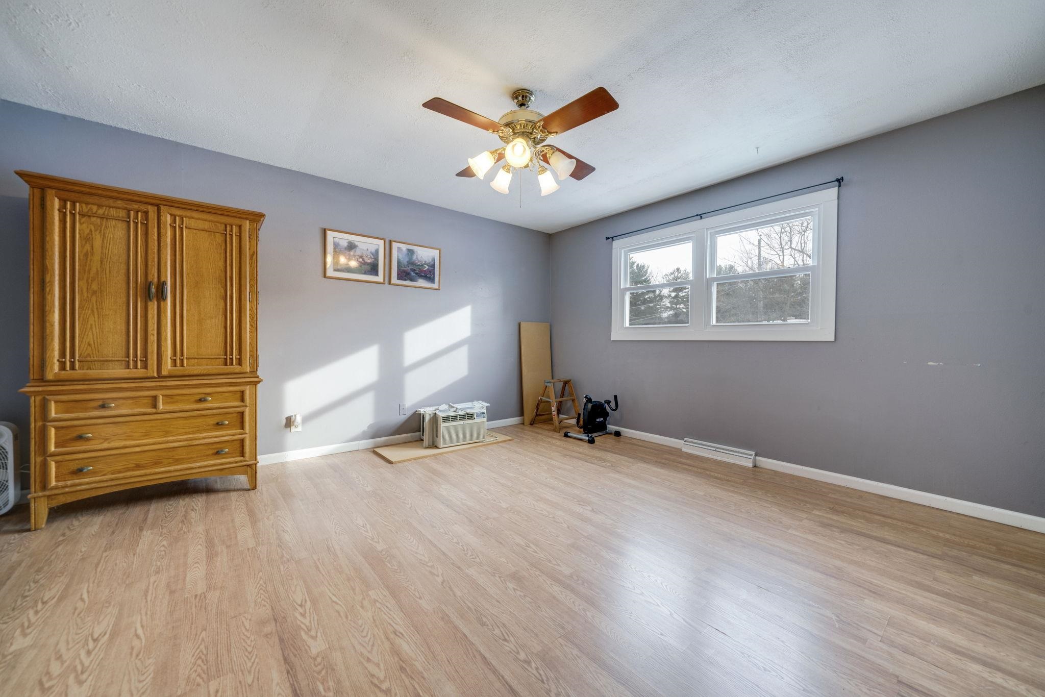5393 Lakecrest Road Caledonia, IL 61011 - Photo 30 of 40 a view of an empty room with a window and wooden floor