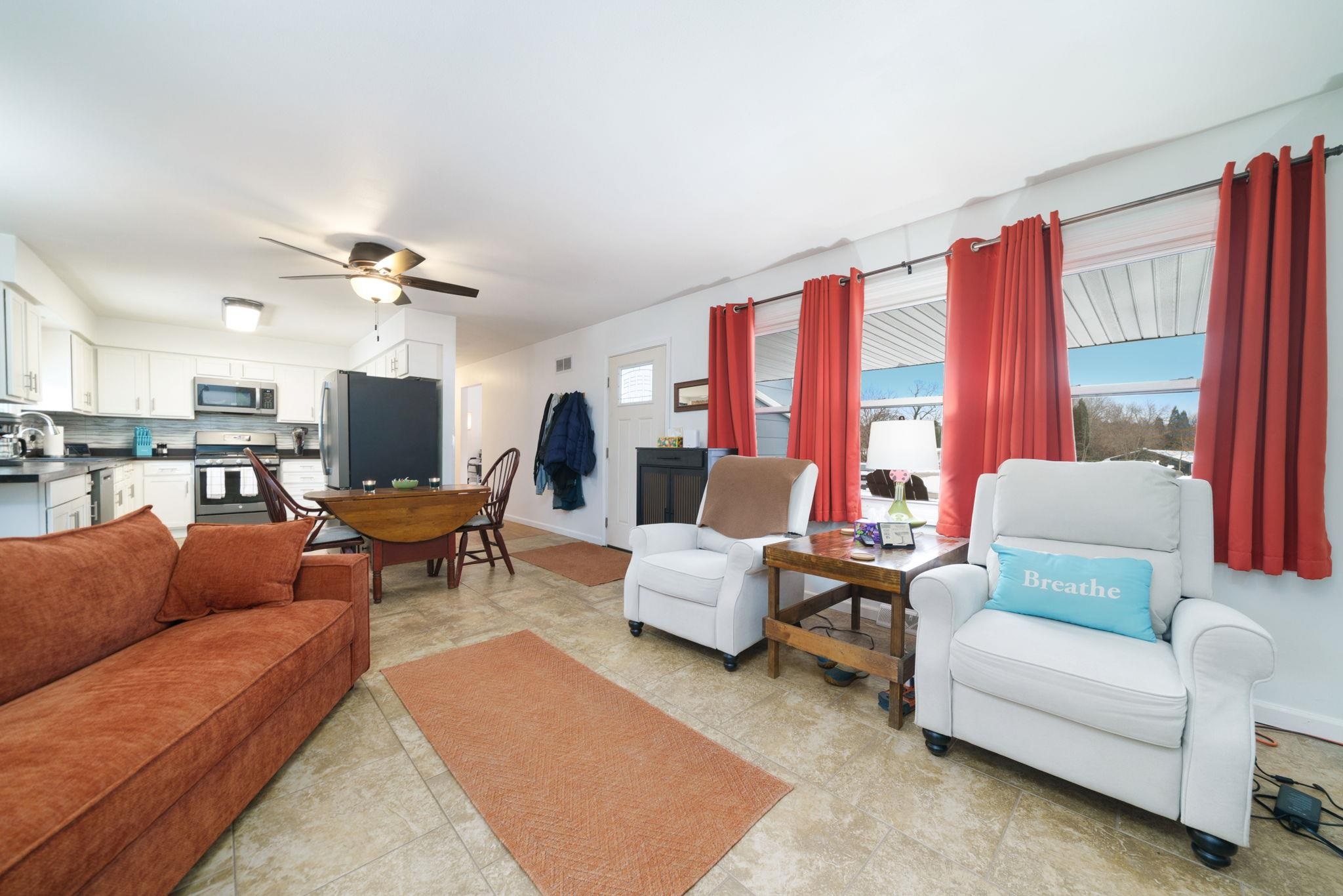 5393 Lakecrest Road Caledonia, IL 61011 - Photo 5 of 40 a living room with furniture and a large window