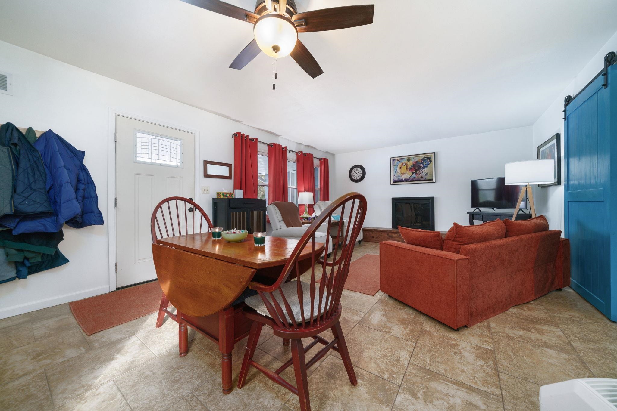 5393 Lakecrest Road Caledonia, IL 61011 - Photo 7 of 40 a living room with furniture and a chandelier