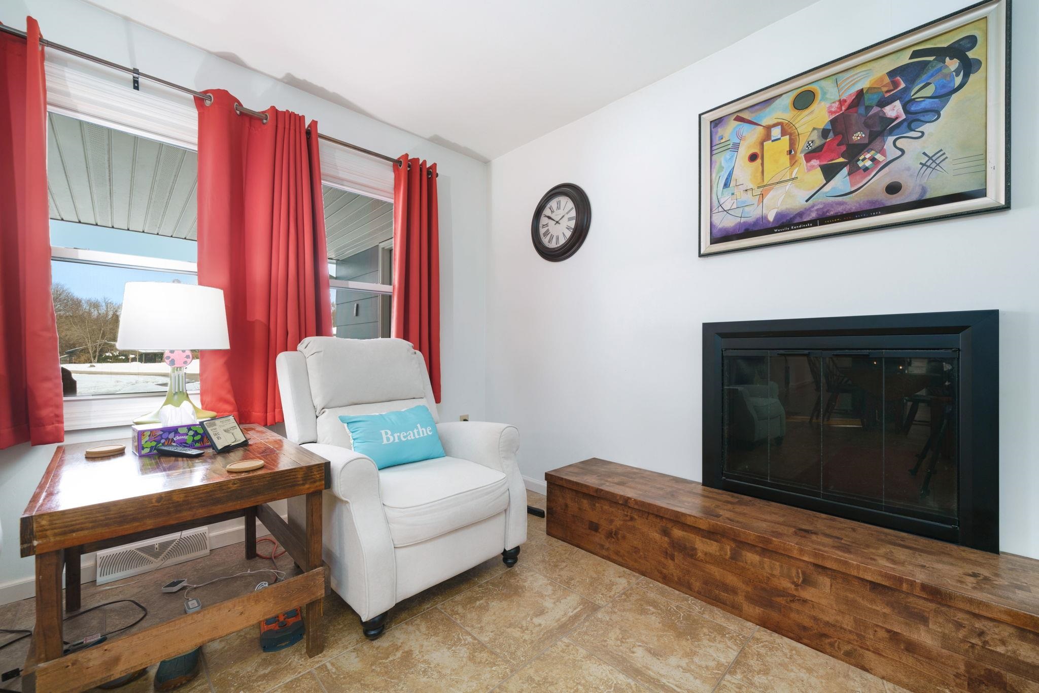 5393 Lakecrest Road Caledonia, IL 61011 - Photo 9 of 40 a living room with furniture and a fireplace