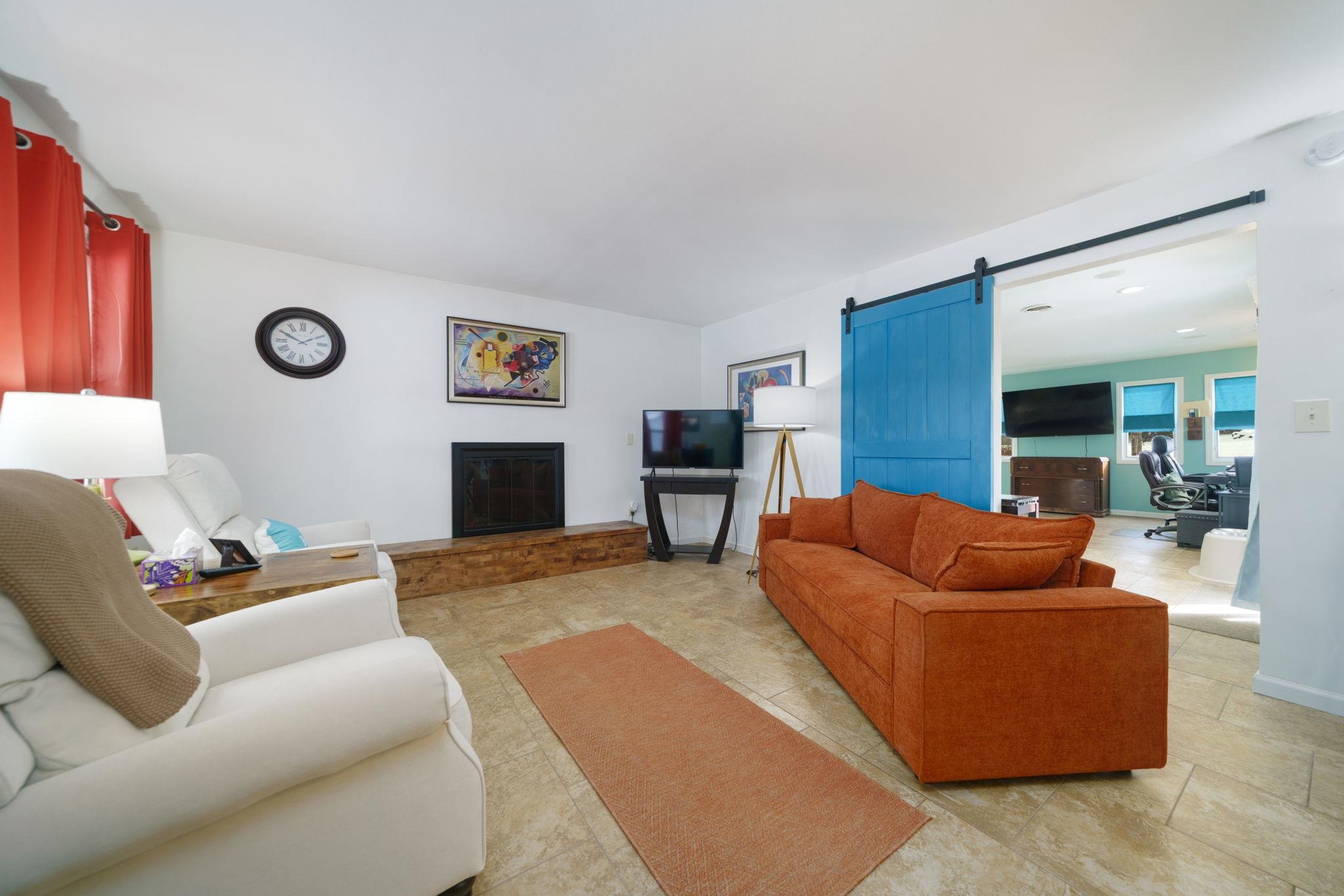 5393 Lakecrest Road Caledonia, IL 61011 - Photo 10 of 40 a living room with furniture and a flat screen tv