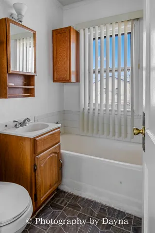 a view of a livingroom with a refrigerator
