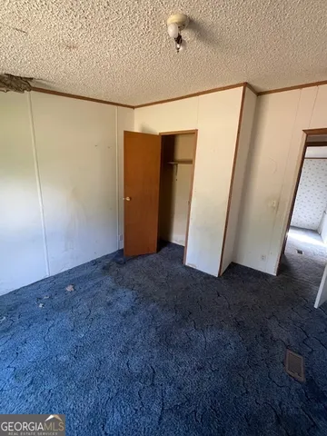 a view of a big room with staircase