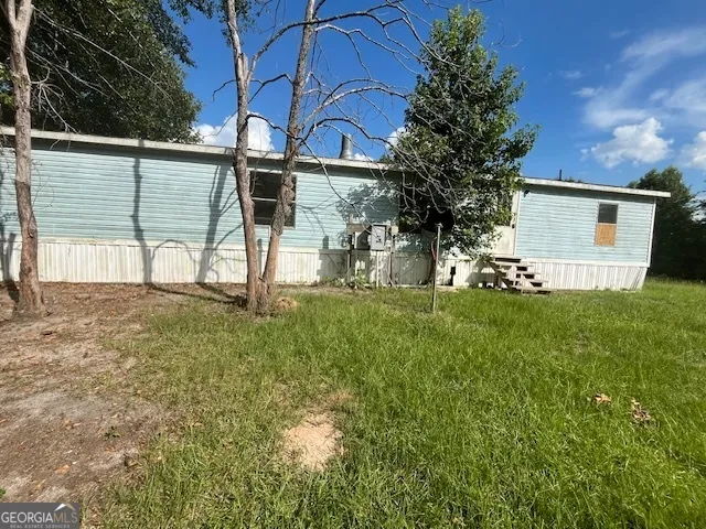 a view of a back yard of the house