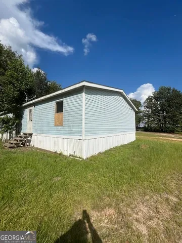 a view of a backyard of the house