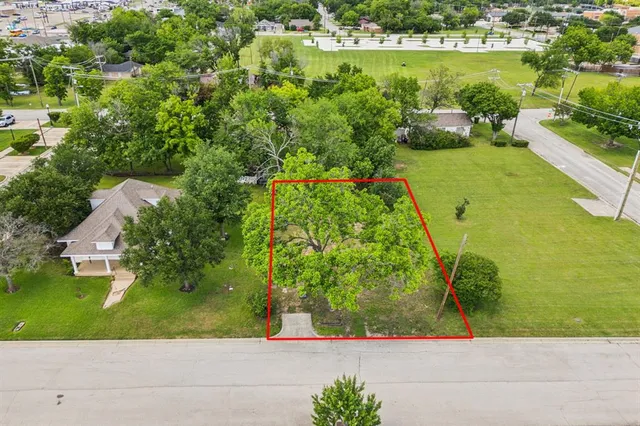 an aerial view of a house with a yard lake view and mountain view